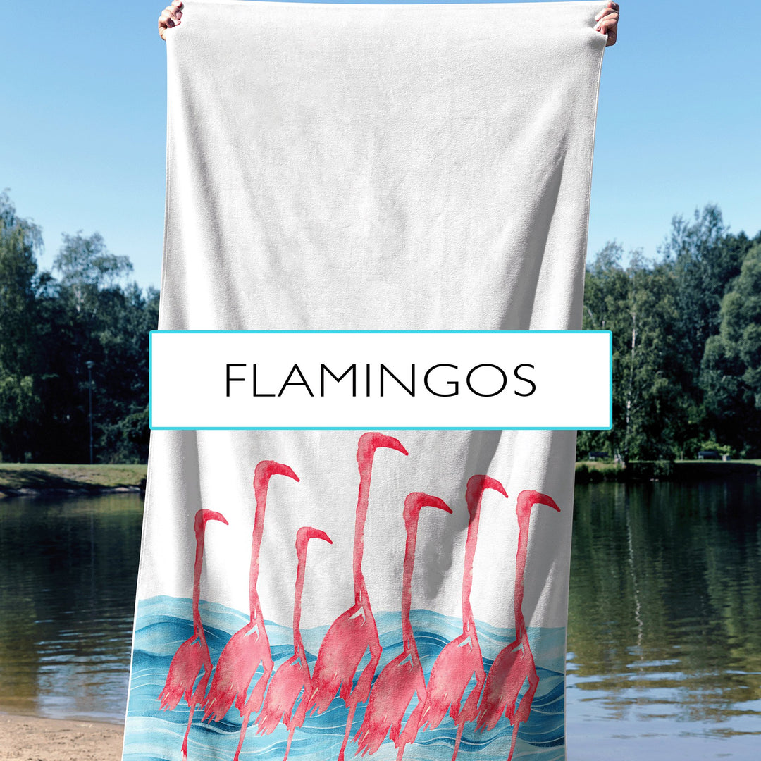 Flock of pink flamingos against a caribbean blue watercolor background on a beach towel