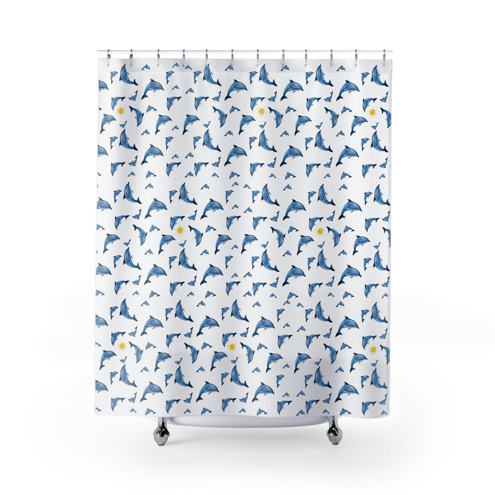 Dolphin shower curtain featuring playful blue dolphins and yellow suns on a white background, hung on a curved rod in a modern bathroom.
