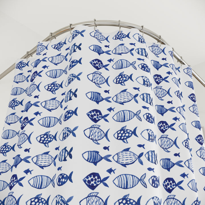 Close-up view of the blue fish-pattern shower curtain, showcasing the intricate details of the design on durable polyester fabric.